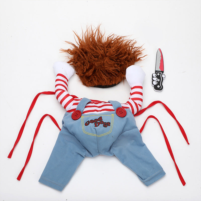 Halloween Chucky-style pet costume laid flat with striped shirt, denim overalls, orange wig, and toy knife prop