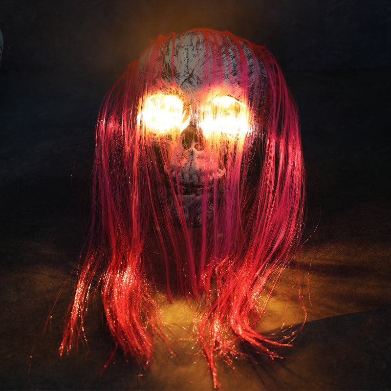 Ribbon Hair Skull Halloween LED decoration with long red hair strands and glowing amber eyes