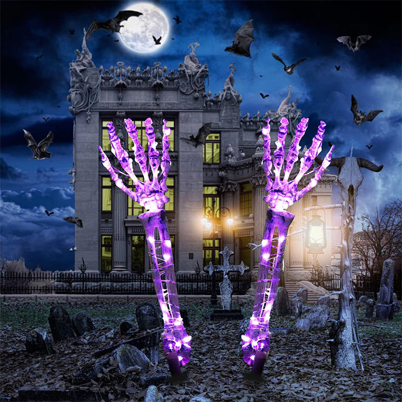 Purple Left And Right Hand Halloween LED skeleton hand yard stakes with haunted house background