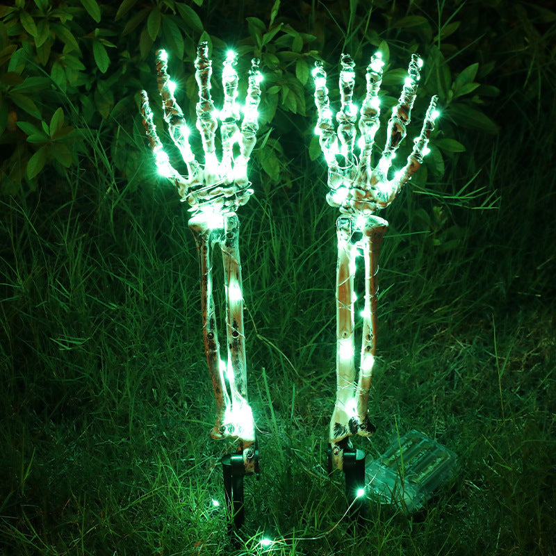 Green Left And Right Hand Halloween LED skeleton hand yard stakes glowing in grass at night