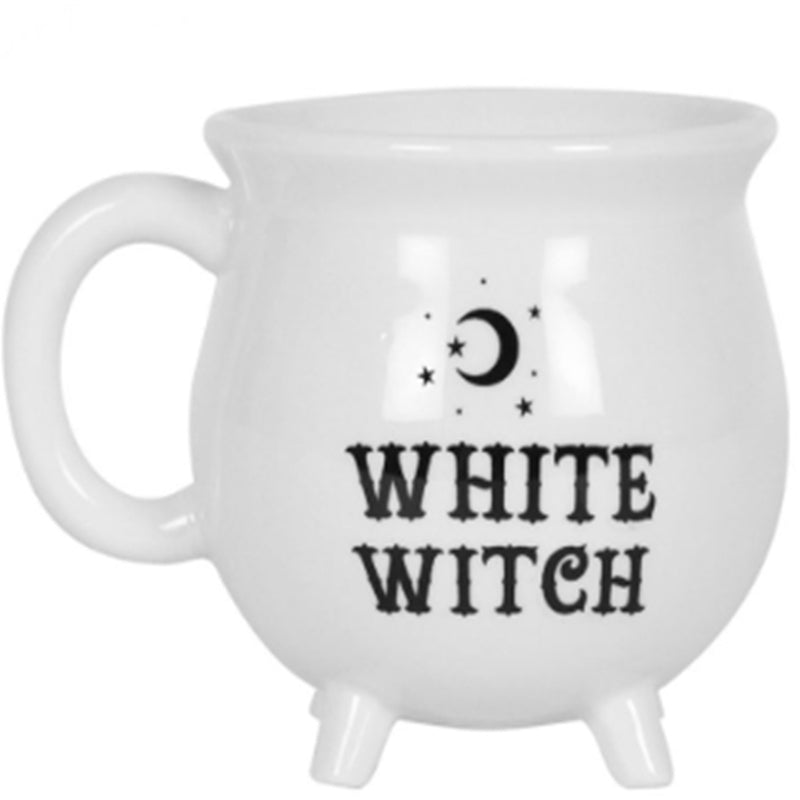 White cauldron-shaped ceramic mug with White Witch text and moon and stars design