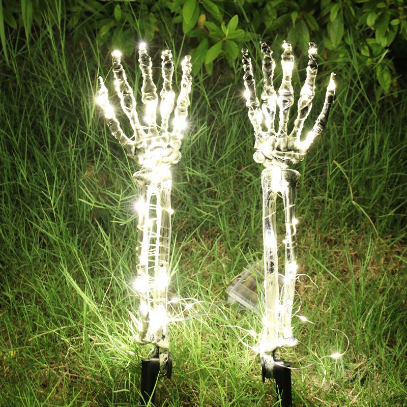 Warm White Left And Right Hand Halloween LED skeleton hand yard stakes glowing in grass